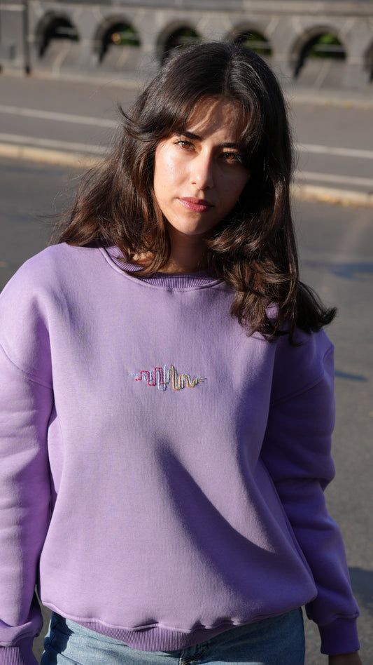 Model wearing Momeni Vivaldi Summer Purple Sweatshirt, unique artisan hand-embroidered piece