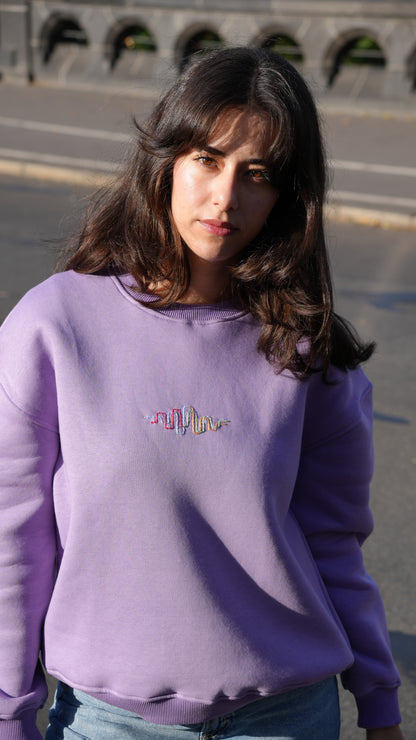 Model wearing Momeni Vivaldi Summer Purple Sweatshirt, unique artisan hand-embroidered piece