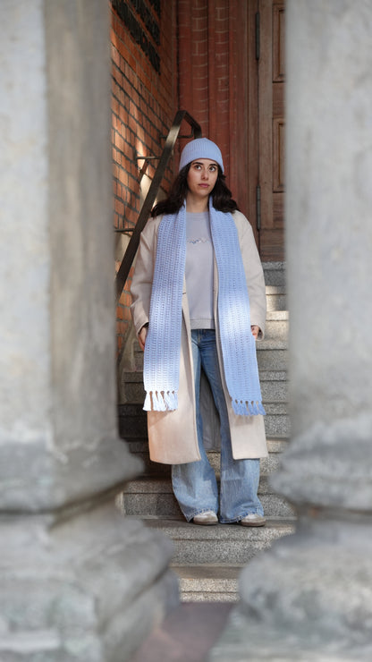 Model wearing Mozaika Collective Sky Blue Cozy Knits Scarf, breathable handmade artisan scarf
