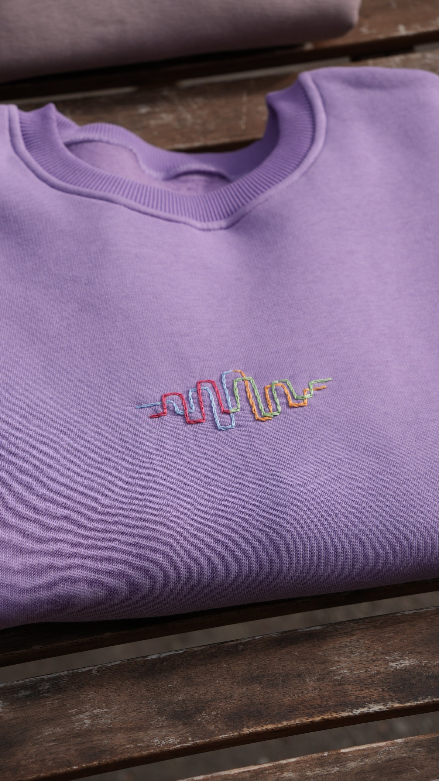 Momeni Vivaldi Summer Purple Sweatshirt front view, Four Seasons Collection embroidery detail