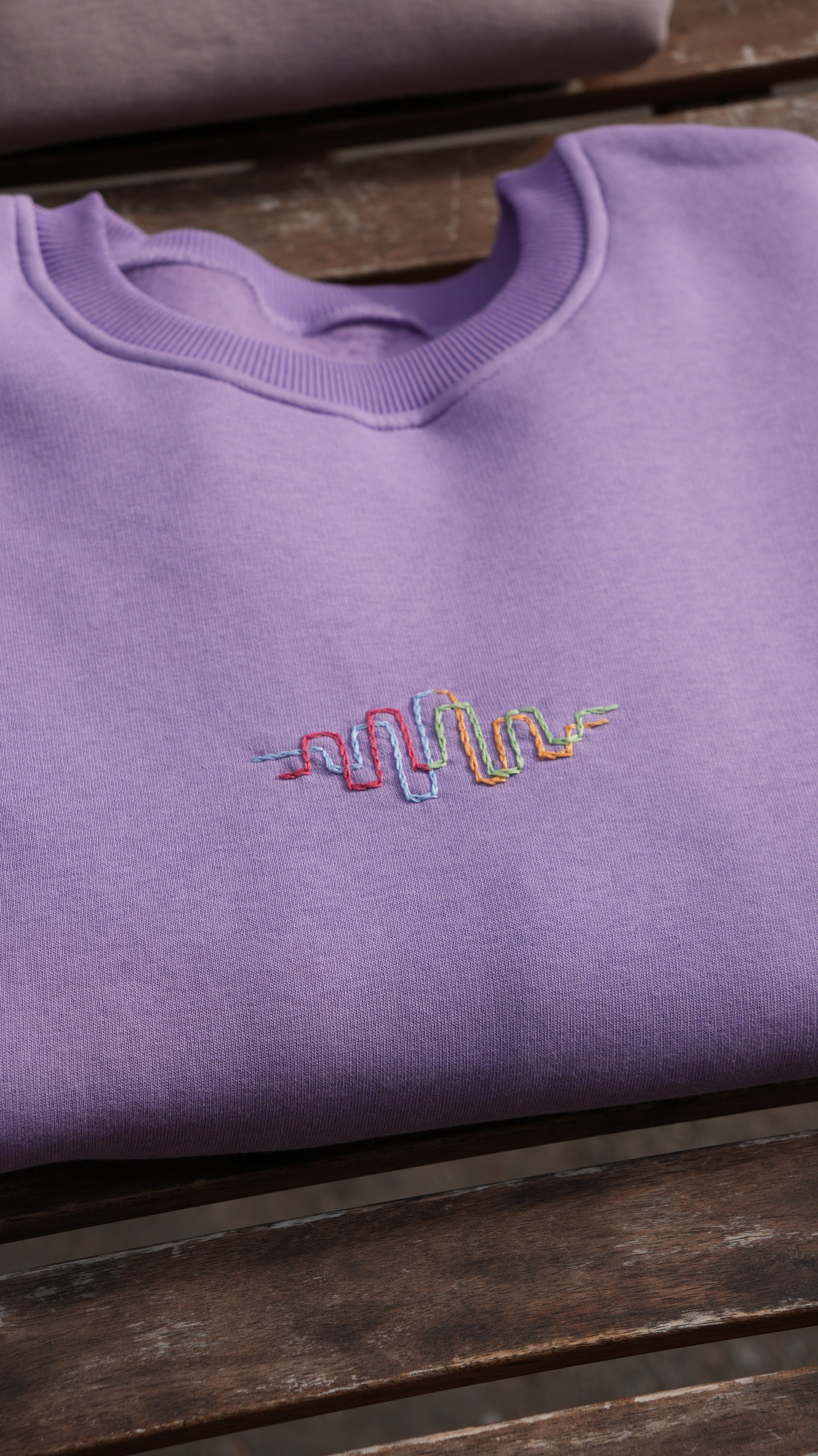 Momeni Vivaldi Summer Purple Sweatshirt front view, Four Seasons Collection embroidery detail