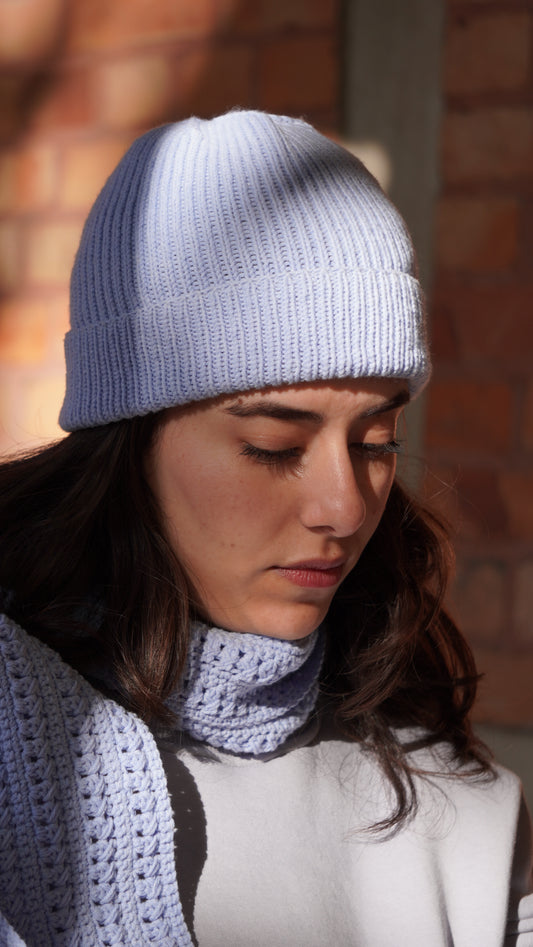 Model wearing Mozaika Collective Sky Blue Cozy Knits Beanie, soft breathable everyday beanie