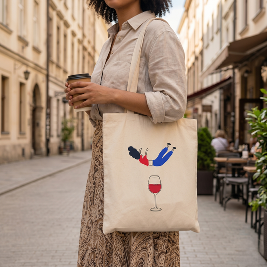 Bael Falling into Wine Tote Bag close-up showing hand embroidery motif on organic canvas