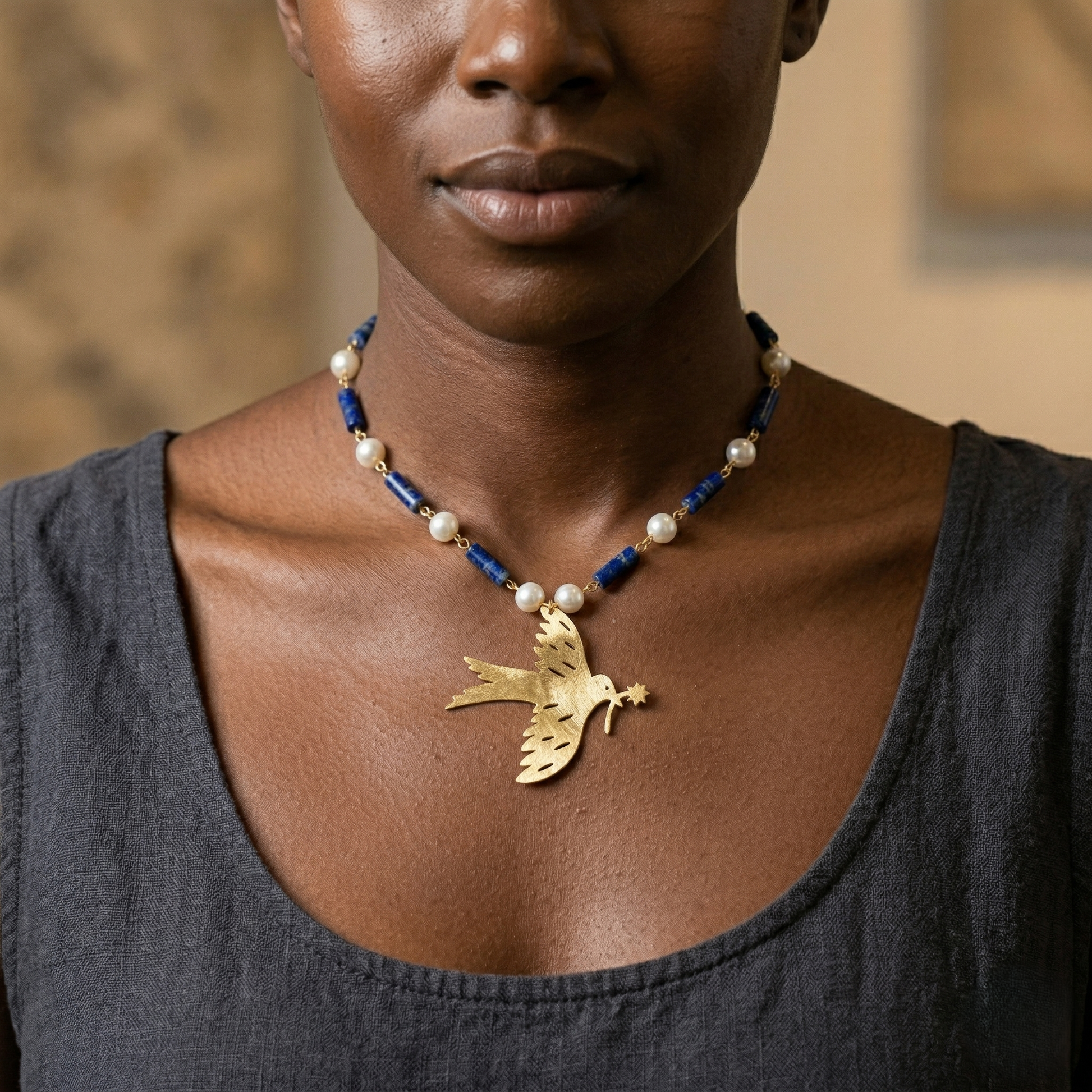Mozaika Collective Peace Dove Necklace flat lay, artisan solid brass jewellery Berlin