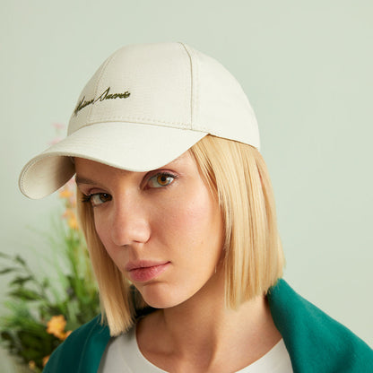 Beige Cap detail view showing Bien Vivre embroidery